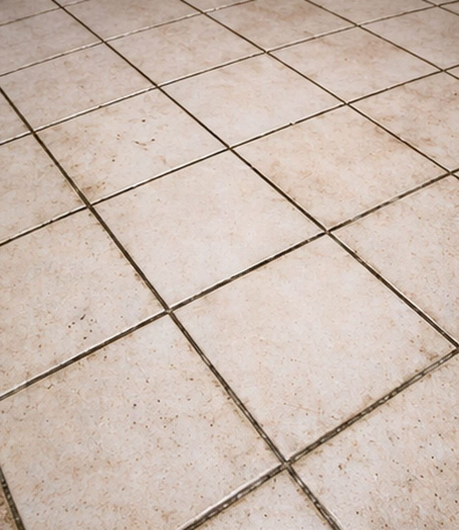 Dirty discoloured tile grout before regrouting