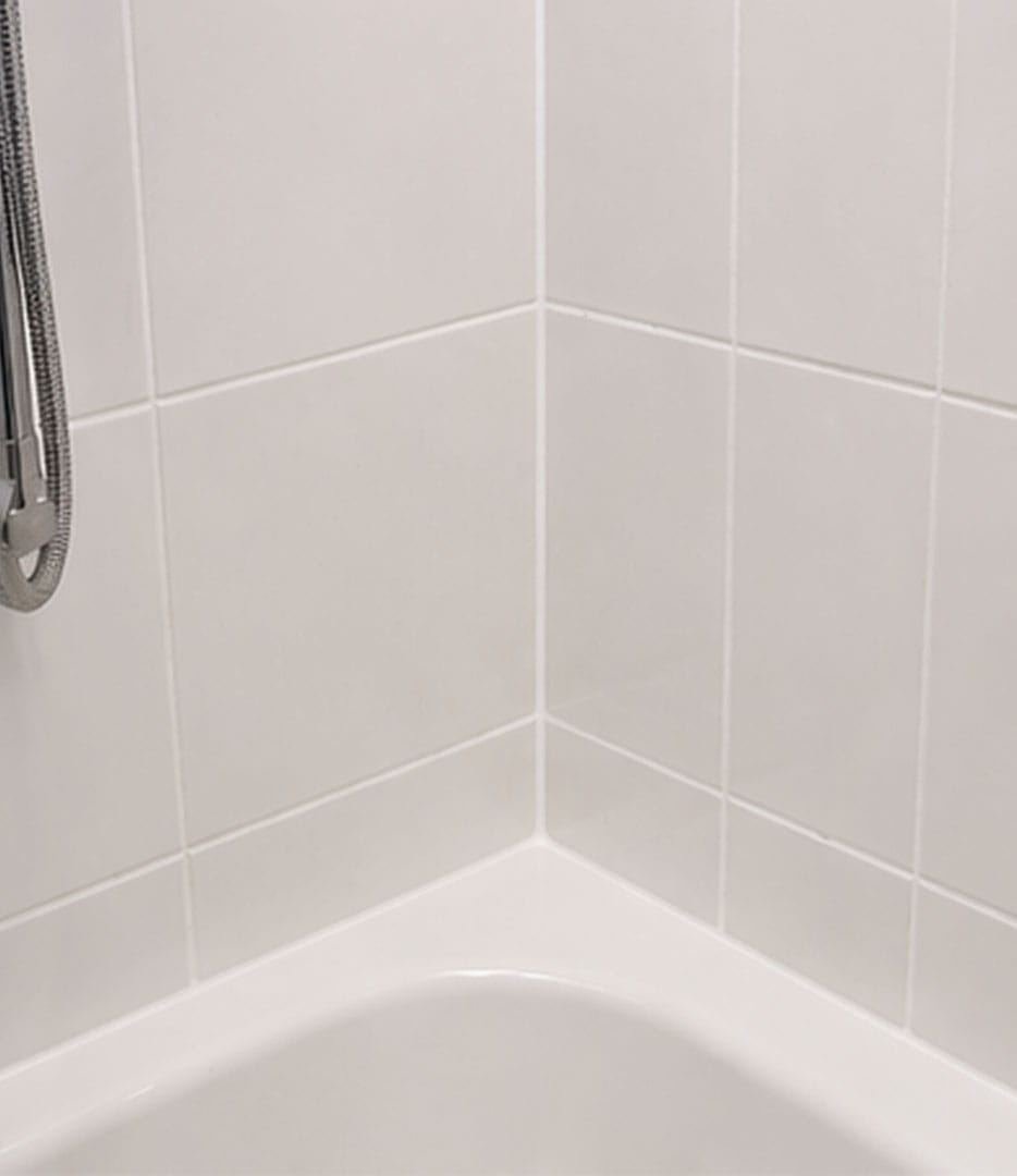 Fresh white grout after mouldy grout removal and regrouting