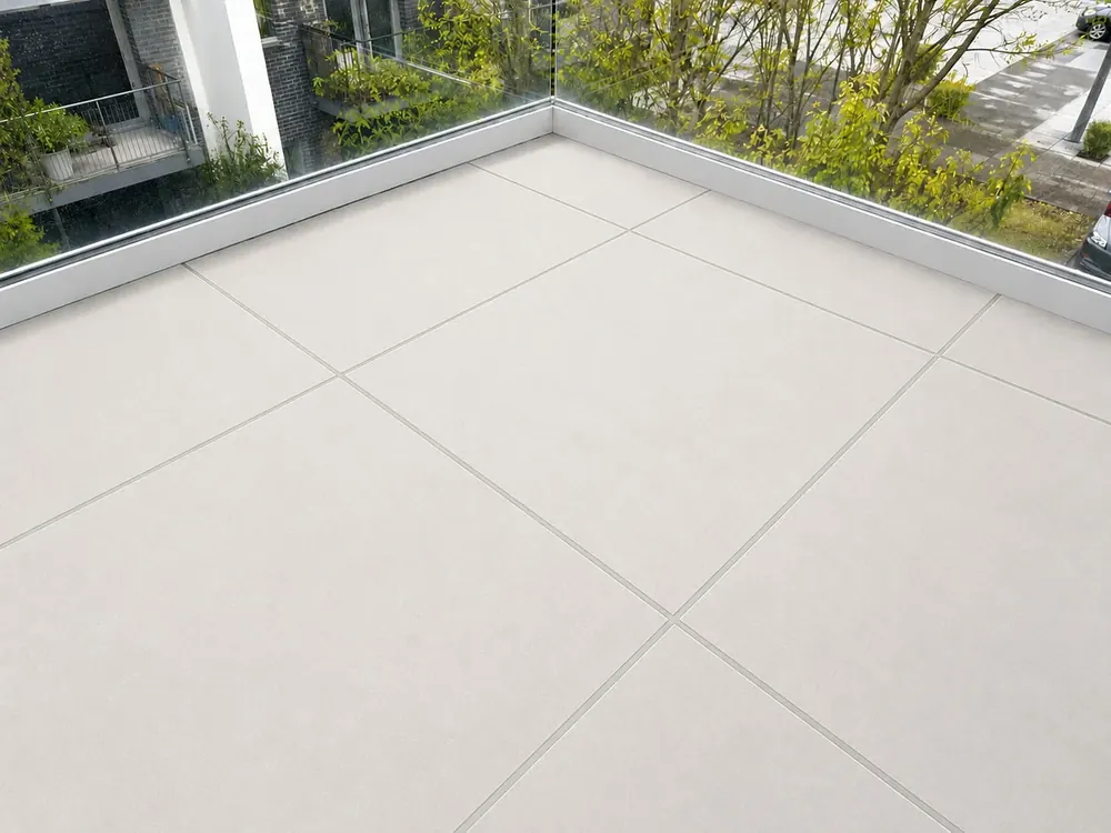 Balcony tiles with new light grey grout after regrouting