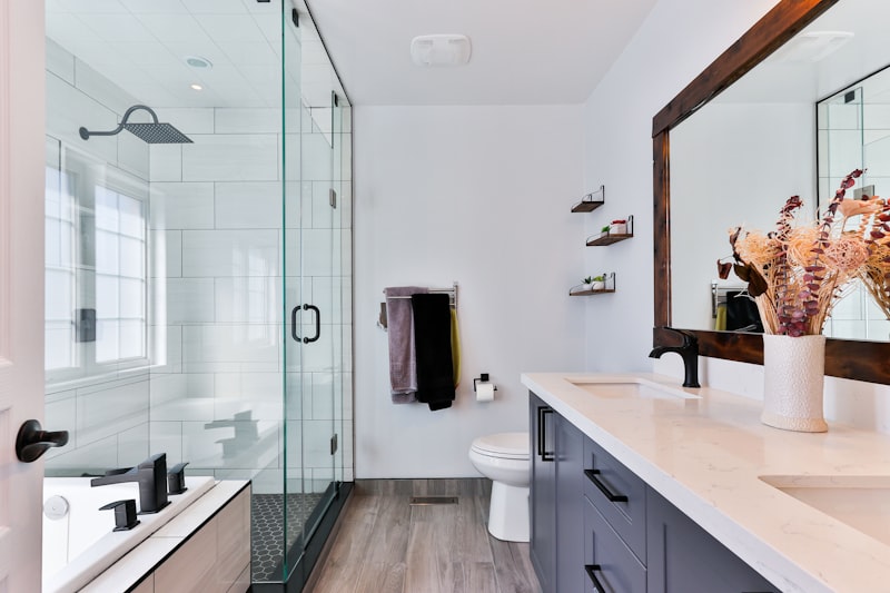 Side by side comparison of cement grout and epoxy grout in a shower